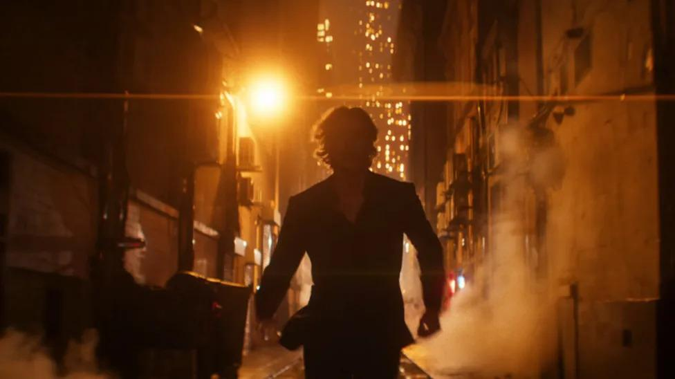 Matt Hagen running down Gotham Narrows alley in silhouette